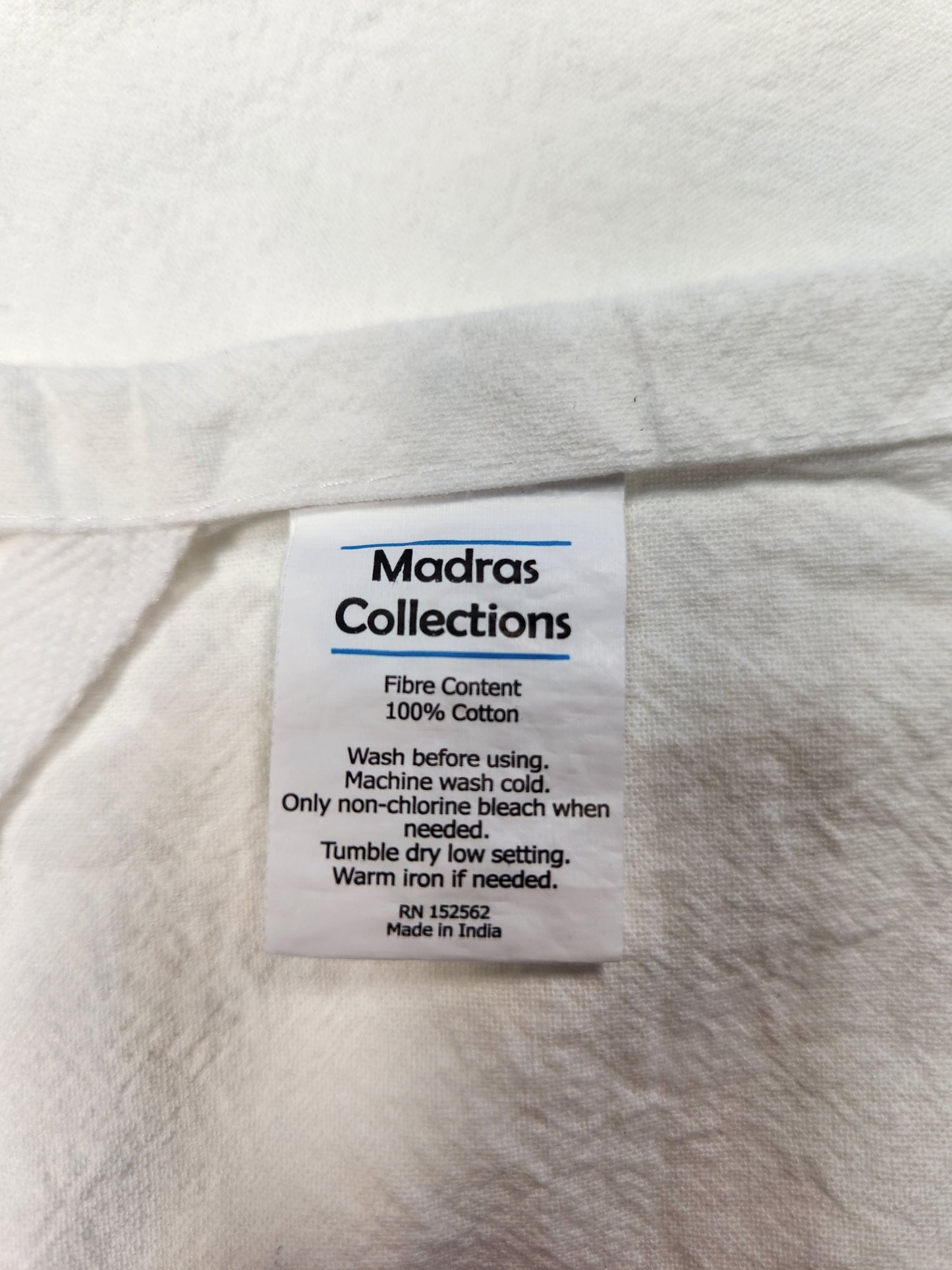 Clothing label on a white fabric background