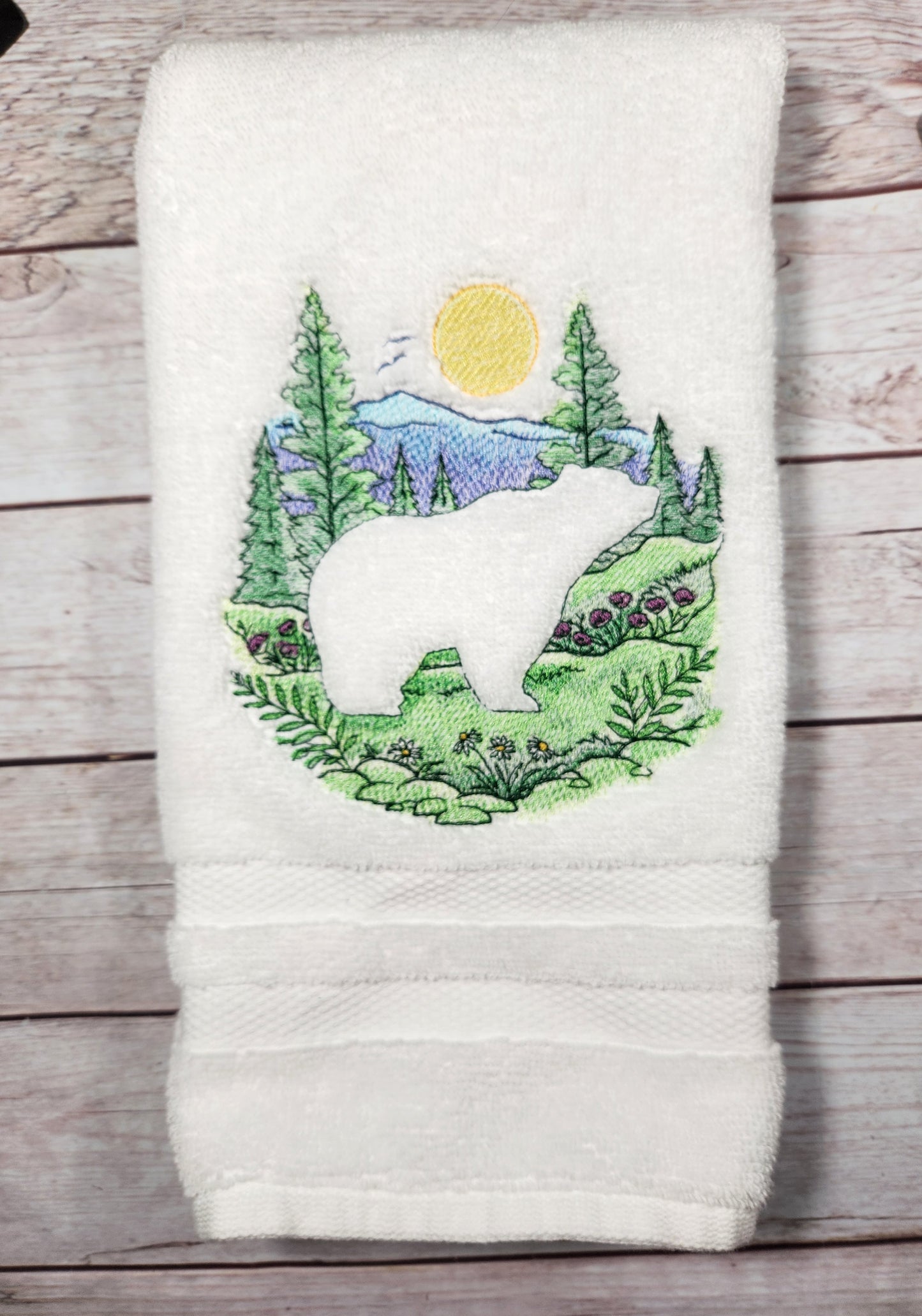 Embroidered bear and scenery embossed style hand towel